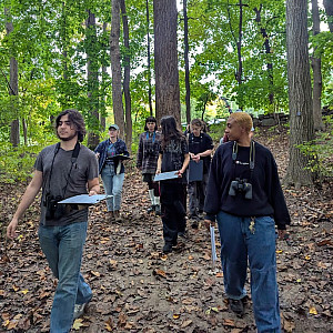 PXL 20241004 213901402 2024 Wildlife Ecology students learning about phenology from Dr. Hanna Makowski in the campus woods
