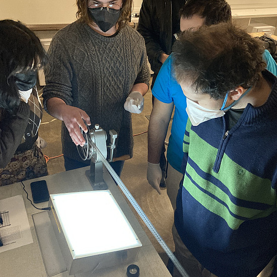 students inspecting 16mm film